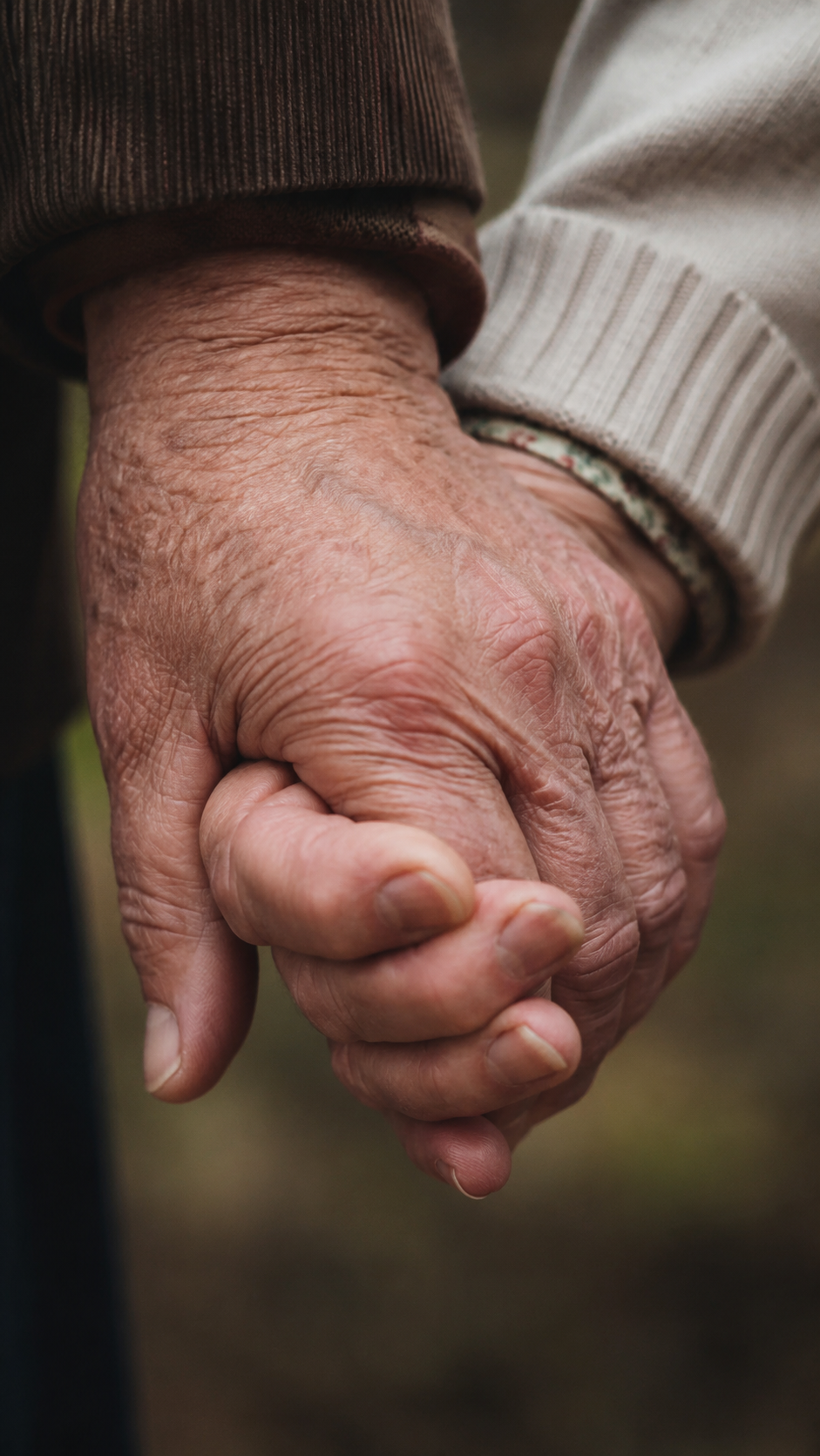 Elderly hands holding together